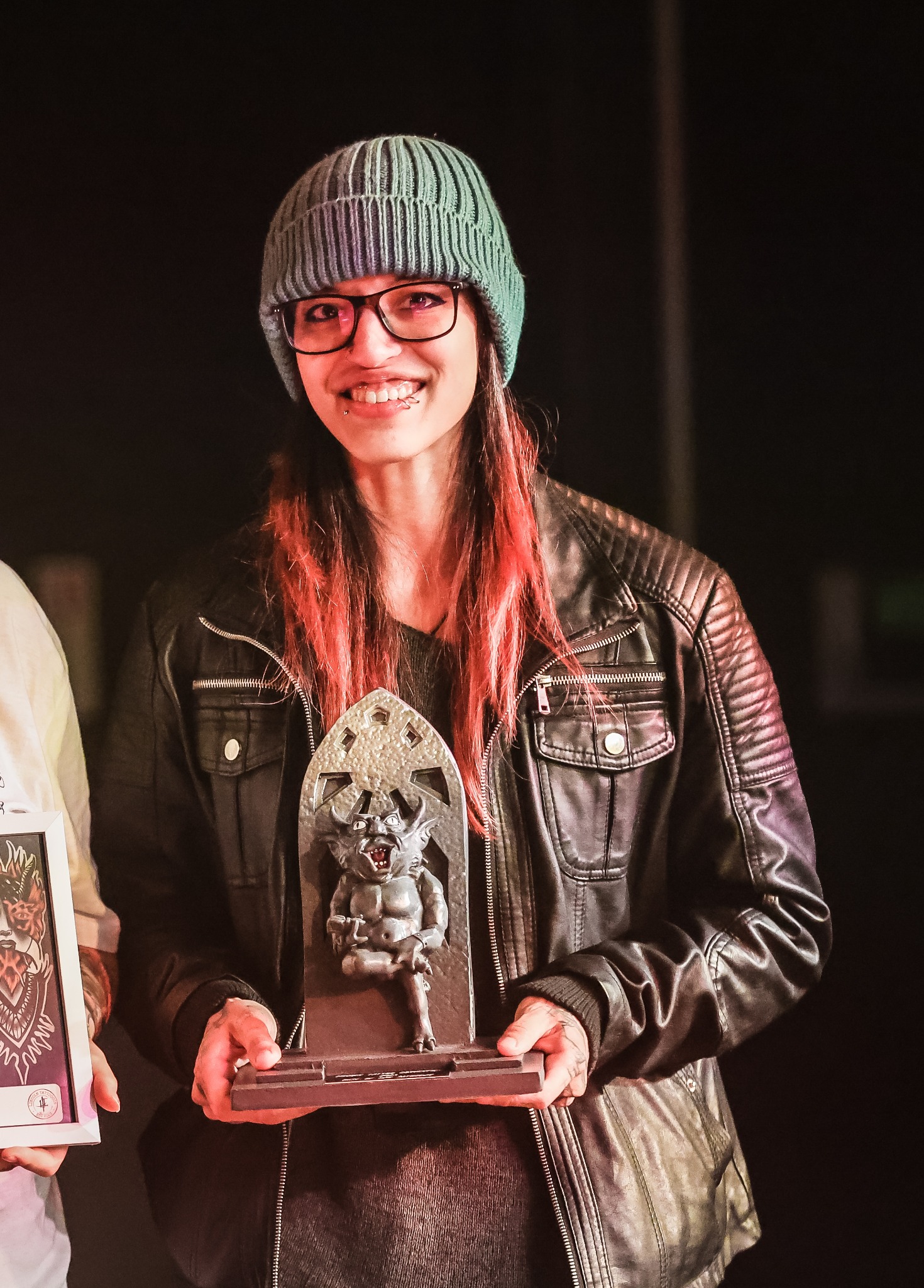 Kimmi Gayle holding a convention award